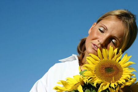 Beautiful Sunflower Woman and a blue sky.の写真素材