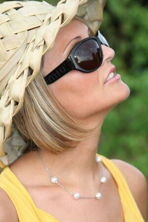 Yellow Summer girl with sun glassesの写真素材