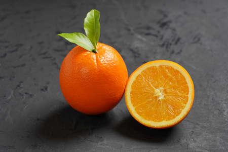 Fresh Orange fruit on black stone table background.Orange Fruitの写真素材