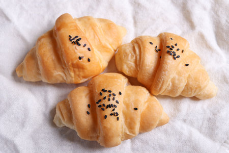 Top view of freshly made croissants laid on whites.の写真素材