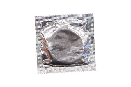 Condom packets laying on white background.clipping path.の写真素材