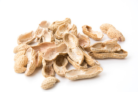 roasted peanuts isolated on white backgroundの写真素材
