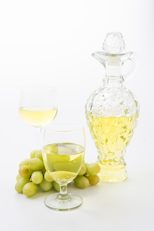 white wine and grapes isolatedの写真素材