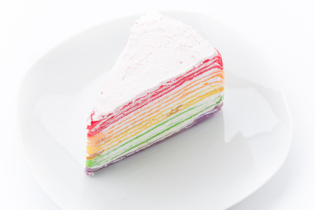 Rainbow crepe cake isolated on white backgroundの写真素材