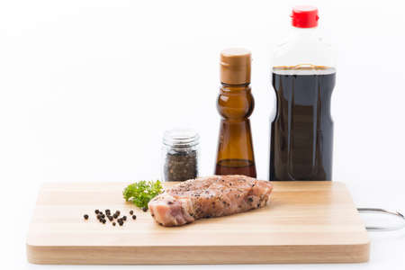 raw meat pork steak with black pepperの写真素材