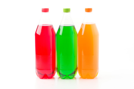 Bottles with soft drinks, isolated on a white backgroundの写真素材
