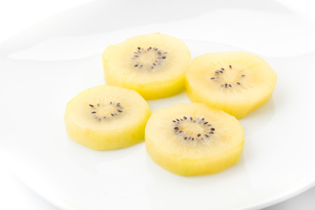 Golden Kiwi fruit isolated on white backgroundの写真素材