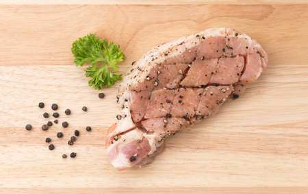 raw meat pork steak with black pepperの写真素材