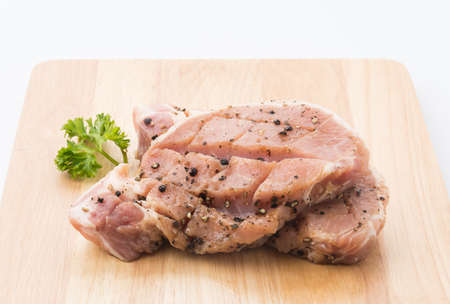 raw meat pork steak with black pepperの写真素材