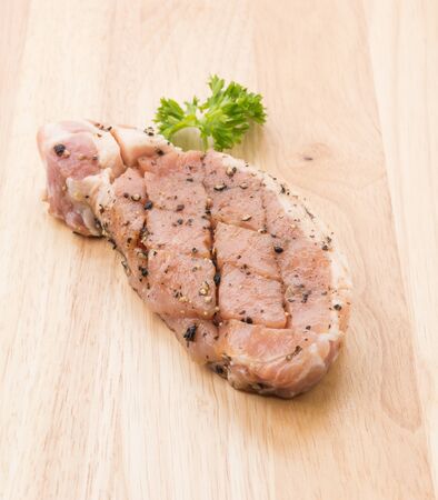 raw meat pork steak with black pepperの写真素材