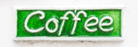 coffee sign on white wallの写真素材