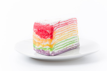 Rainbow crepe cake isolated on white backgroundの写真素材