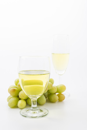 white wine and grapes isolatedの写真素材