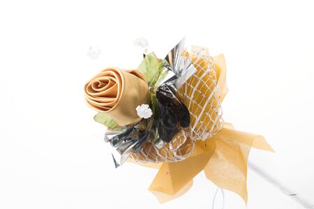 golden rose isolated on white backgroundの写真素材