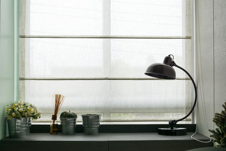 black lamp on wooden deskの写真素材
