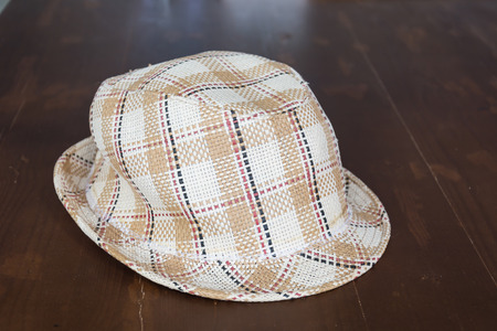 hat on wood tableの写真素材