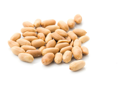 roasted peanuts isolated on white backgroundの写真素材