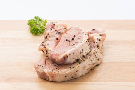 raw meat pork steak with black pepperの写真素材