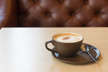 a cup of coffee on wood tableの写真素材