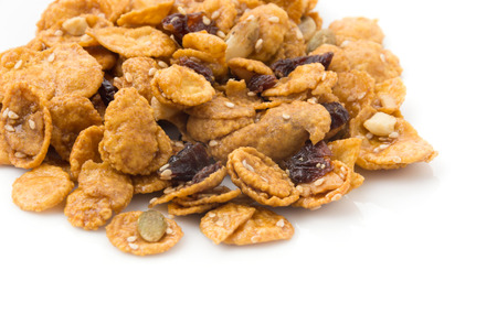 cornflakes and caramel isolated on white backgroundの写真素材