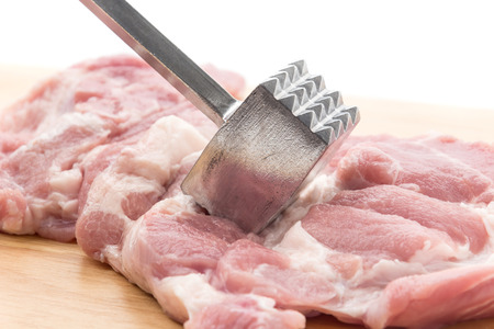 Meat Tenderizer on wooden boardの写真素材