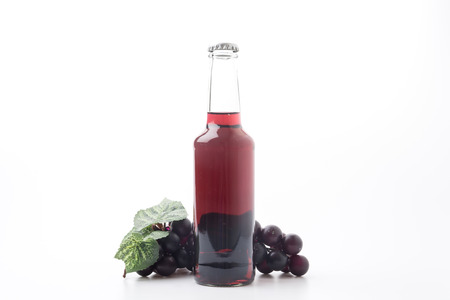 red grape wine isolated on white backgroundの写真素材