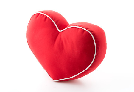 red heart pillow on white backgroundの写真素材