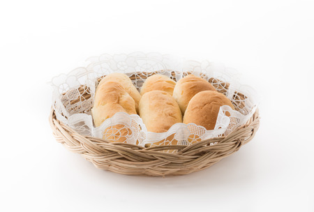 bread in basket on white backgroundの写真素材