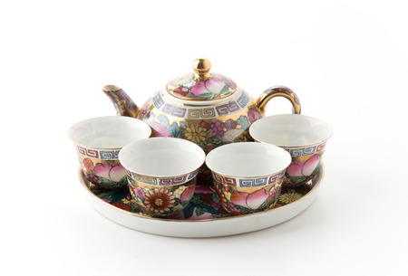teapot and cup on white background