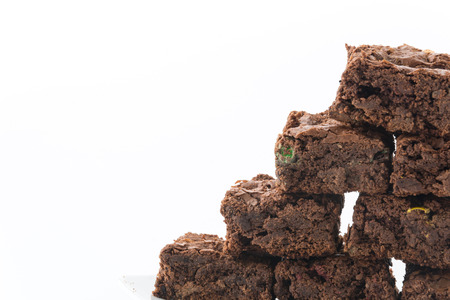 chocolate brownies with chocolate chips on white backgroundの写真素材