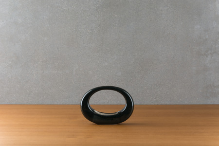 a vase on wood table