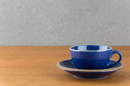 a cup of hot coffee on wood tableの写真素材