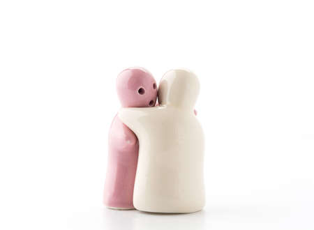 Salt and Pepper Shaker in hug on Whiteの写真素材