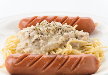spaghetti cream sauce with sausageの写真素材