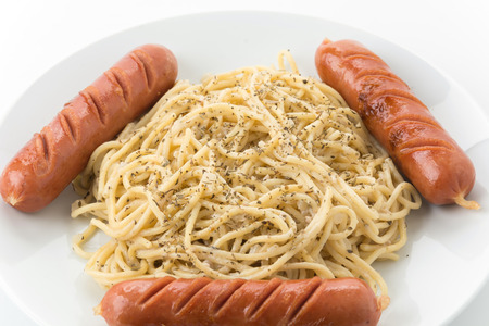 spaghetti cream sauce with sausagesの写真素材