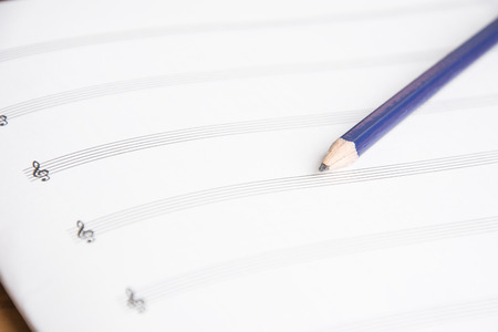 notebook and pencil on wood tableの写真素材