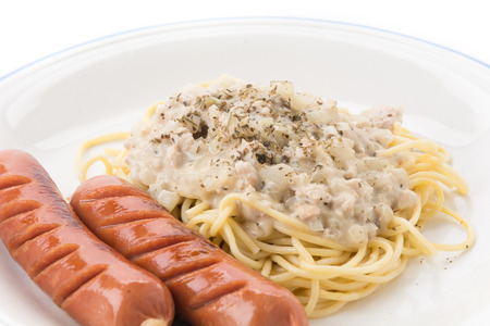 spaghetti cream sauce with sausageの写真素材