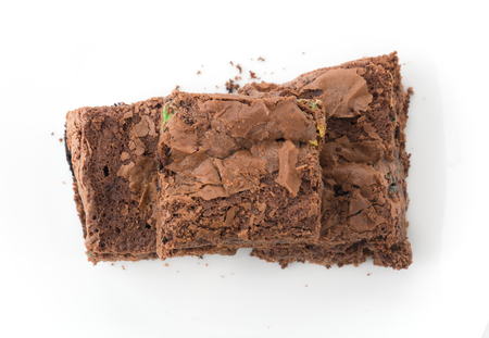 chocolate brownie with chocolate chips on white backgroundの写真素材