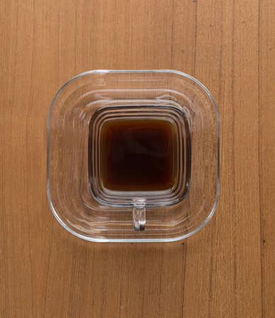 a cup of hot coffee on wood tableの写真素材