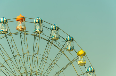 Ferris wheel in blue sky on retro and vintage toneの写真素材