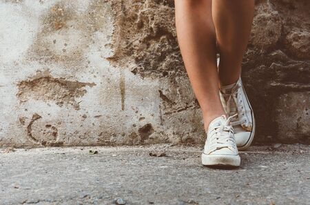 leg girl with white shoes : film texture in vintage styleの写真素材