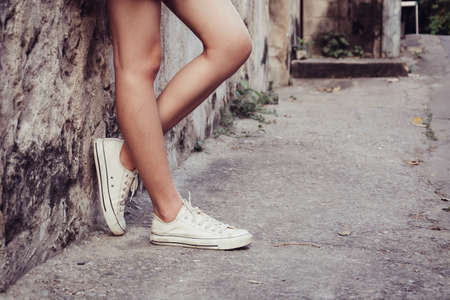 leg girl with white shoes : film texture in vintage styleの写真素材