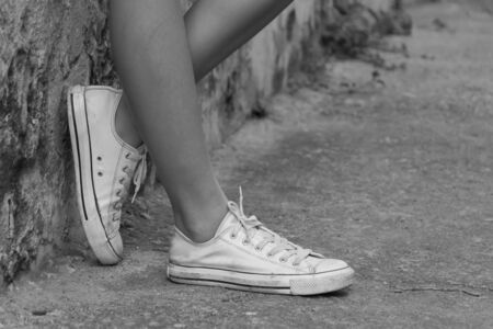 leg girl with white shoes : film texture in vintage styleの写真素材