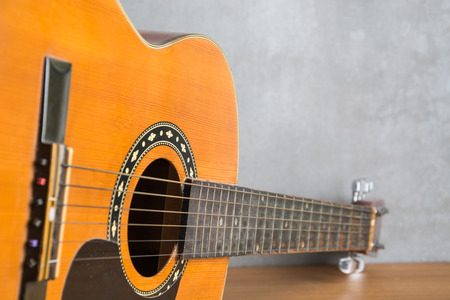 folk guitar on wood table