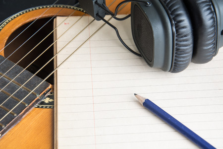 headphone guitar notebook and pencilの写真素材
