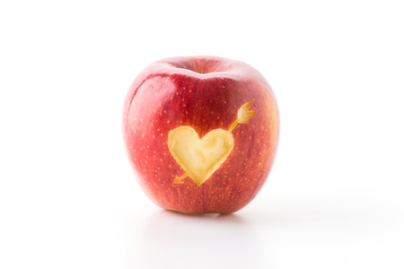 heart shape on red appleの写真素材