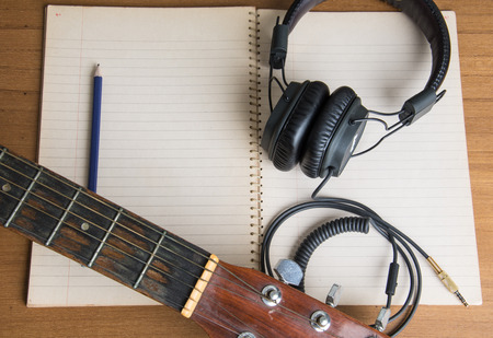 headphone guitar notebook and pencilの写真素材