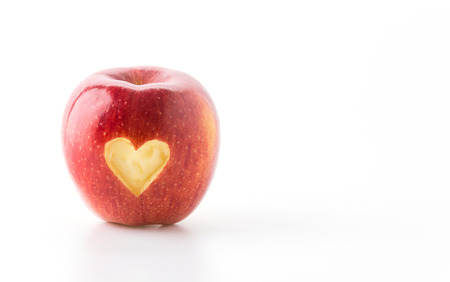 heart shape on red appleの写真素材