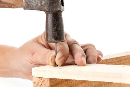 hammer and nail with woodの写真素材