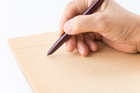 old paper with pen on white backgroundの写真素材